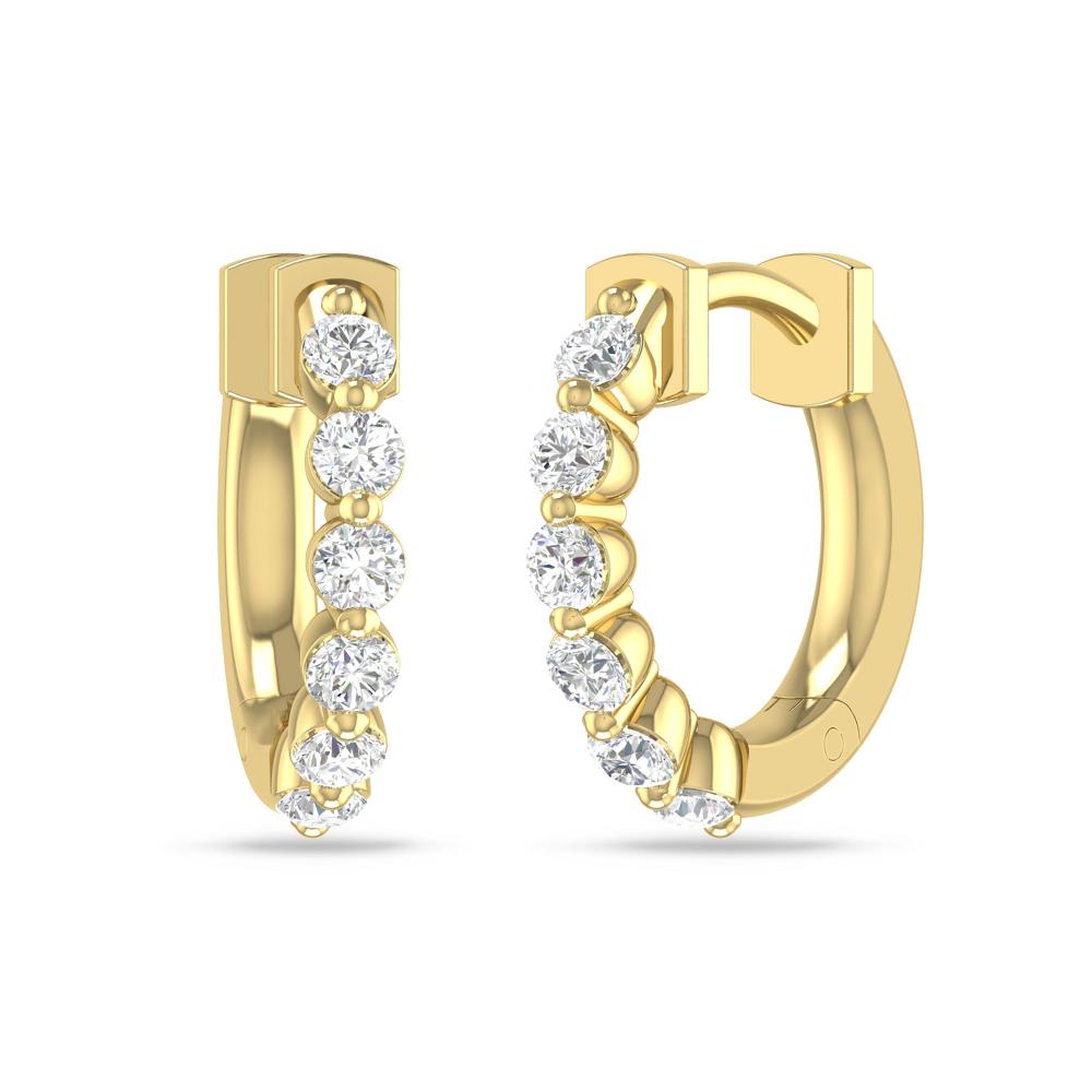 a pair of gold earrings with diamonds