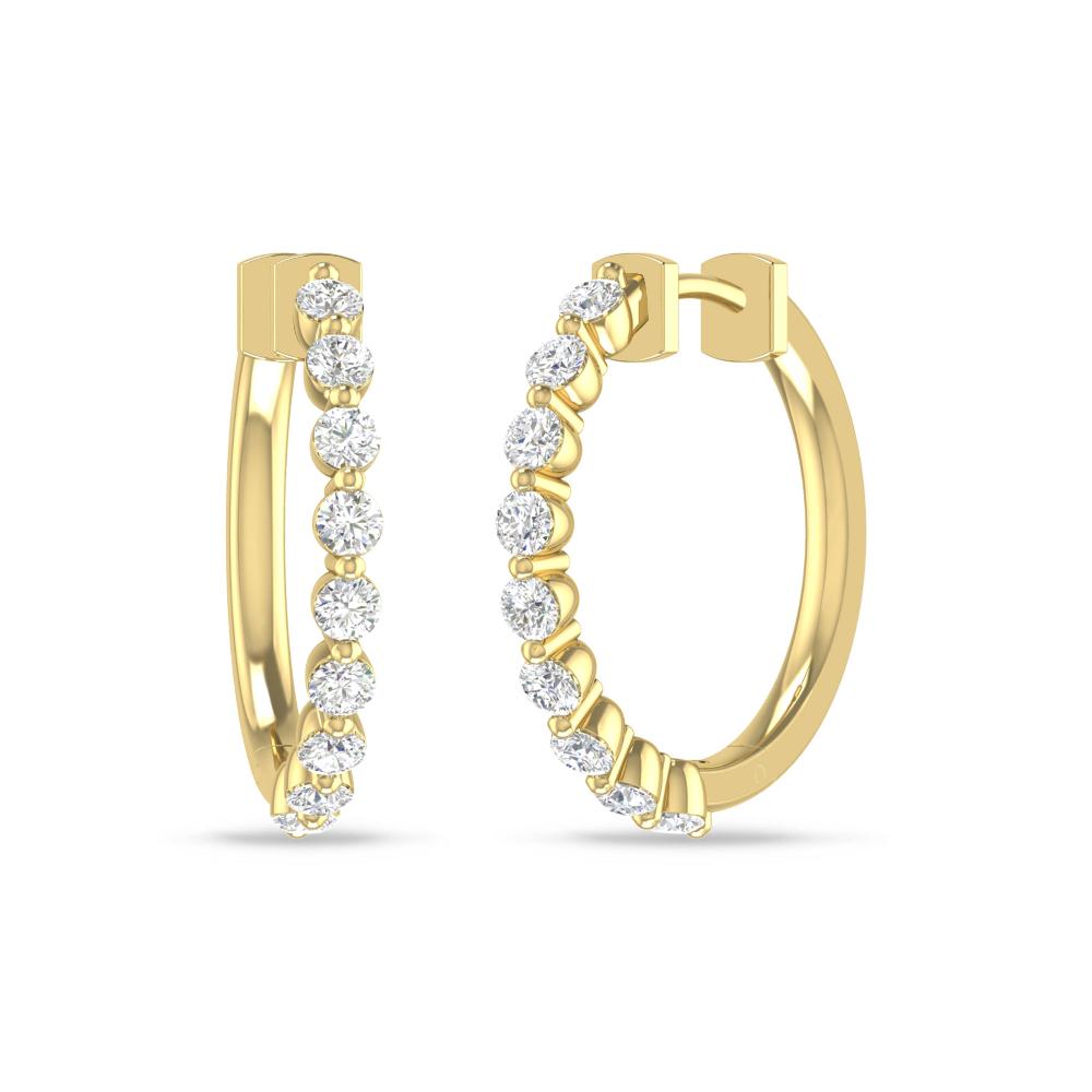 a pair of gold hoop earrings with diamonds