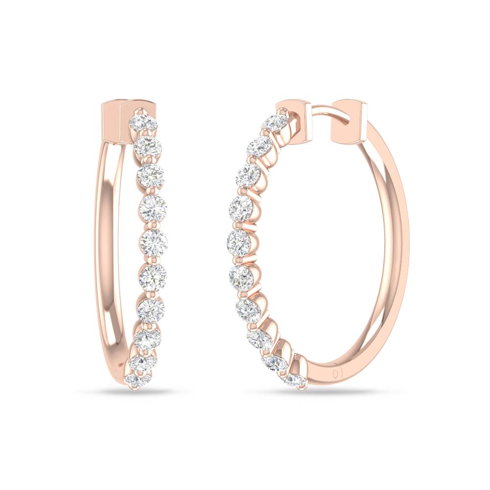 a pair of gold hoop earrings with diamonds