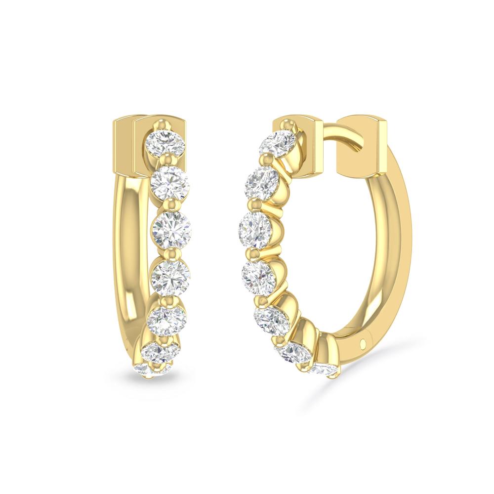 a pair of gold earrings with diamonds